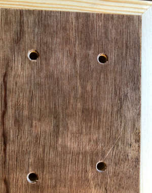 Holder drilled, to take board